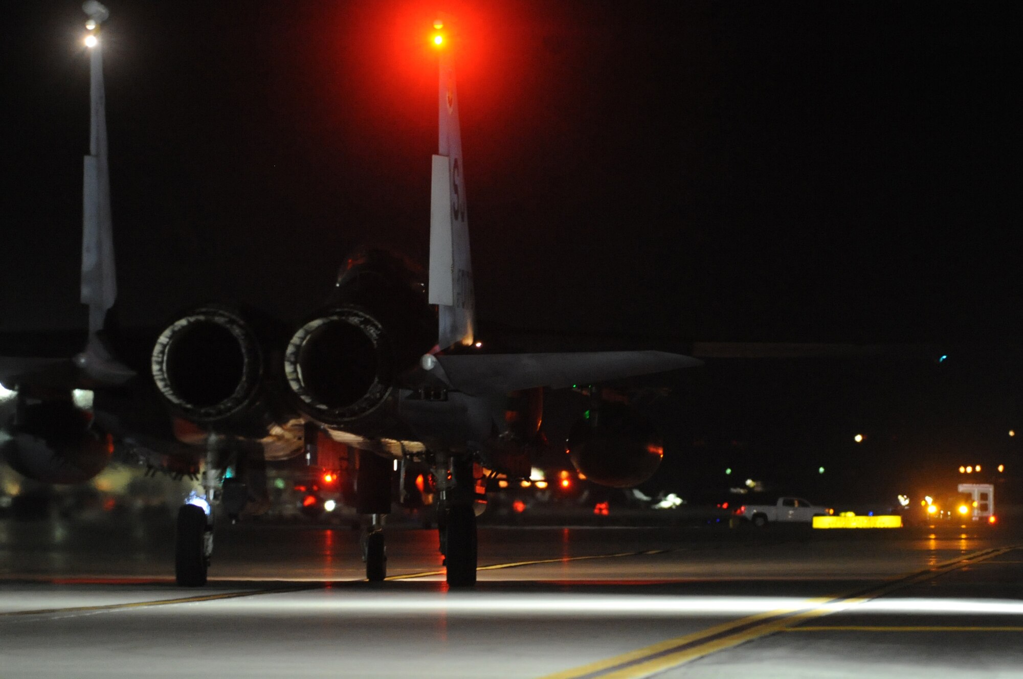 An F-15E Strike Eagle from the 336th Fighter Squadron, Seymour Johnson Air Force Base, N.C., taxis to the runway at Nellis Air Force Base, Nev., March 10, 2014. As part of night operations during Red Flag 14-2, Strike Eagles were joined by other model F-15s as well as F-16 Fighting Falcons from U.S. and coalition units. (Air Force photo/Staff Sgt. Chuck Broadway)