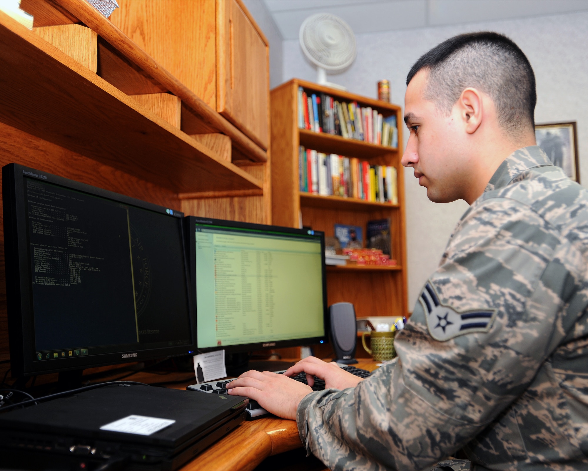 Airman 1st Class Allen Deshane, 319th Communications Squadron client systems technician, attempts to locate and fix a problem on a computer on Grand Forks Air Force Base, N.D., March 10, 2014. Deshane is the base’s Warrior of the Week for the second week of March 2014. (U.S. Air Force photo/Airman 1st Class Zachiah Roberson)