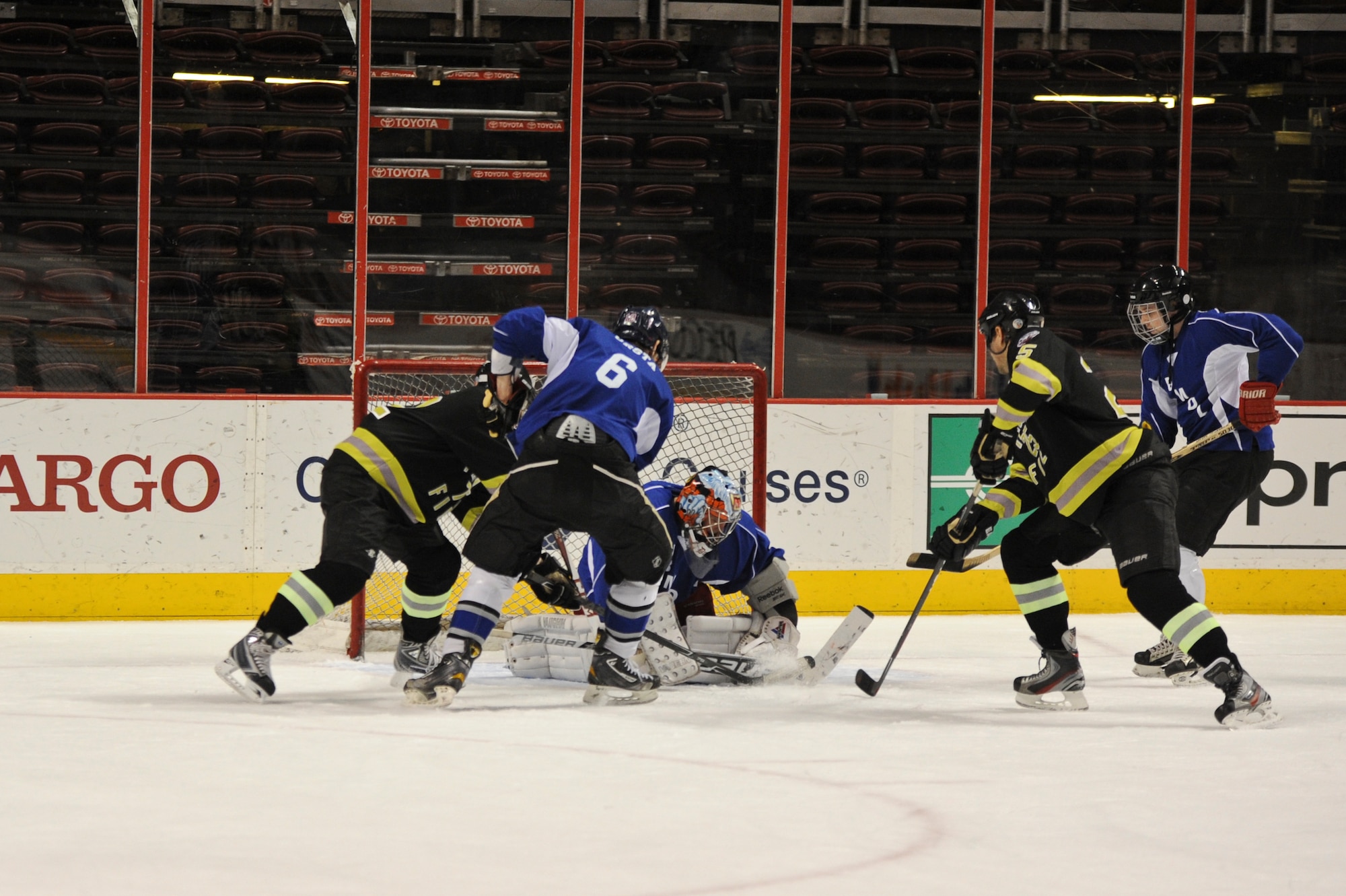 The Philadelphia Fire Department’s Steve Walls scores on the Joint Base McGuire-Dix-Lakehurst Hockey Team for the first point of the game March 6, 2014, at the Wells Fargo Center in Philadelphia. JB MDL defeated PFD 4-3 during the special game meant to highlight the base’s hockey program resurgence. (U.S. Air Force photo by Airman 1st Class Sean M. Crowe/Released)