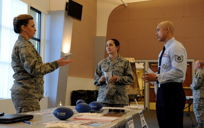 Capt. Autumn Decosta (left), a Work for Warriors project director, speaks to Airmen regarding career opportunities with the Air National Guard at a job fair at Beale Air Force Base, Calif., March 12, 2014. Work for Warriors is a California employment initiative helping Airmen attain civilian employment. (U.S. Air Force photo by Airman 1st Class Bobby Cummings/Released)