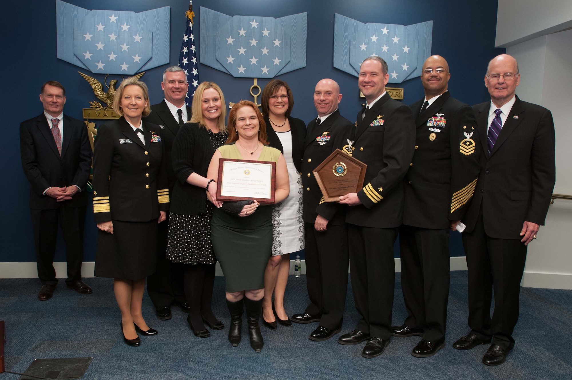 Chief of Navy Reserve Vice Adm. Robin Braun, second from right, poses for a group photo with DoD leadership and members of the "Condors" of Fleet Logistics Support Squadron (VR) 64, winners of the 2013 DOD Reserve Family Readiness Award, after an award ceremony at the Pentagon Hall of Heroes, Feb 28, 2014. The DoD Reserve Family Readiness Award recognizes one National Guard and Reserve unit from each of the seven Reserve components with the best programs to support military families. (U.S. Navy photo by Petty Officer Second Class Armando Gonzales/Released)