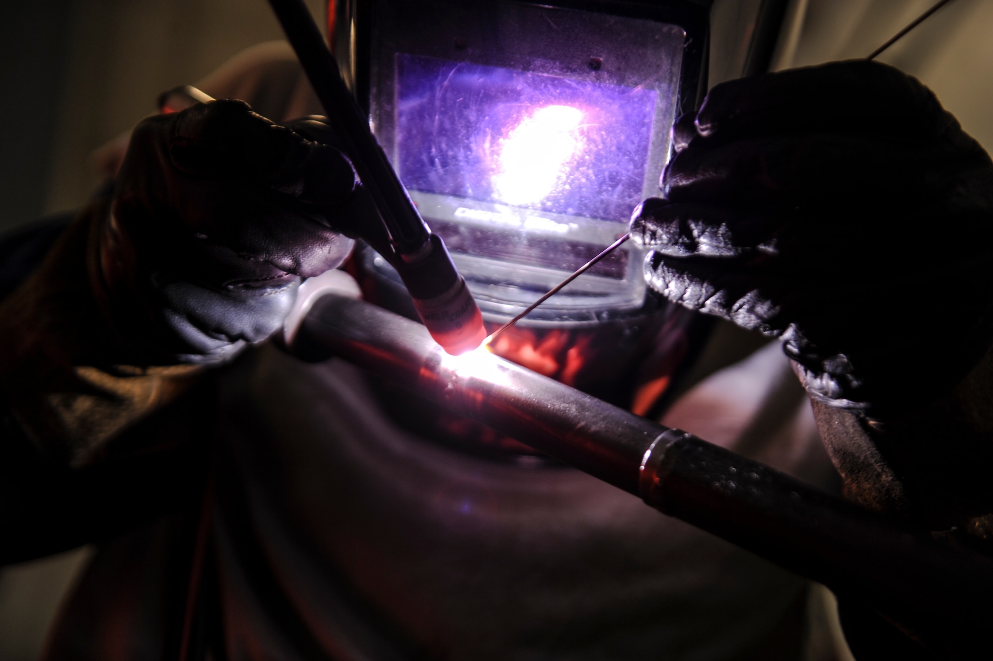 Airman 1st Class Clement Chhay, a 19th Equipment Maintenance Squadron aircraft metal technologies apprentice, practices his tungsten arch welding skills March 11, 2014, at Little Rock Air Force Base, Ark. Technicians in AMT can both repair and manufacture machined, non-procurable aircraft components. (U.S. Air Force photo by Airman 1st Class Cliffton Dolezal)