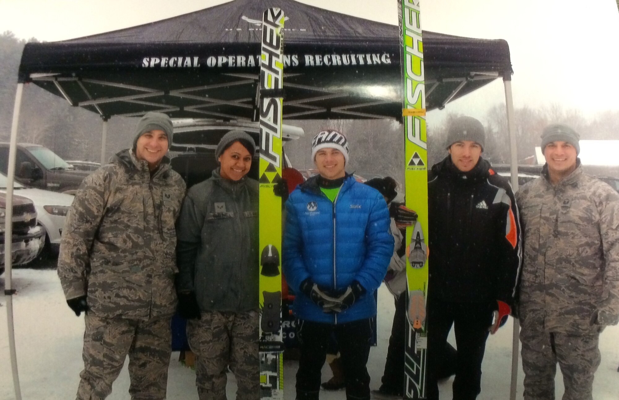 The 319th Recruiting Squadron sponsored the Harris Hill Ski Jumping Competition at Brattleboro, Vt., Feb. 15- 16.  Standing in front of the recruiting booth are, from left: Tech. Sgt. Christopher Battista, Senior Airman Janyll Smiling, two members of the USA ski team and Master Sgt. Nicholas Ellis. (U.S. Air Force photo)
