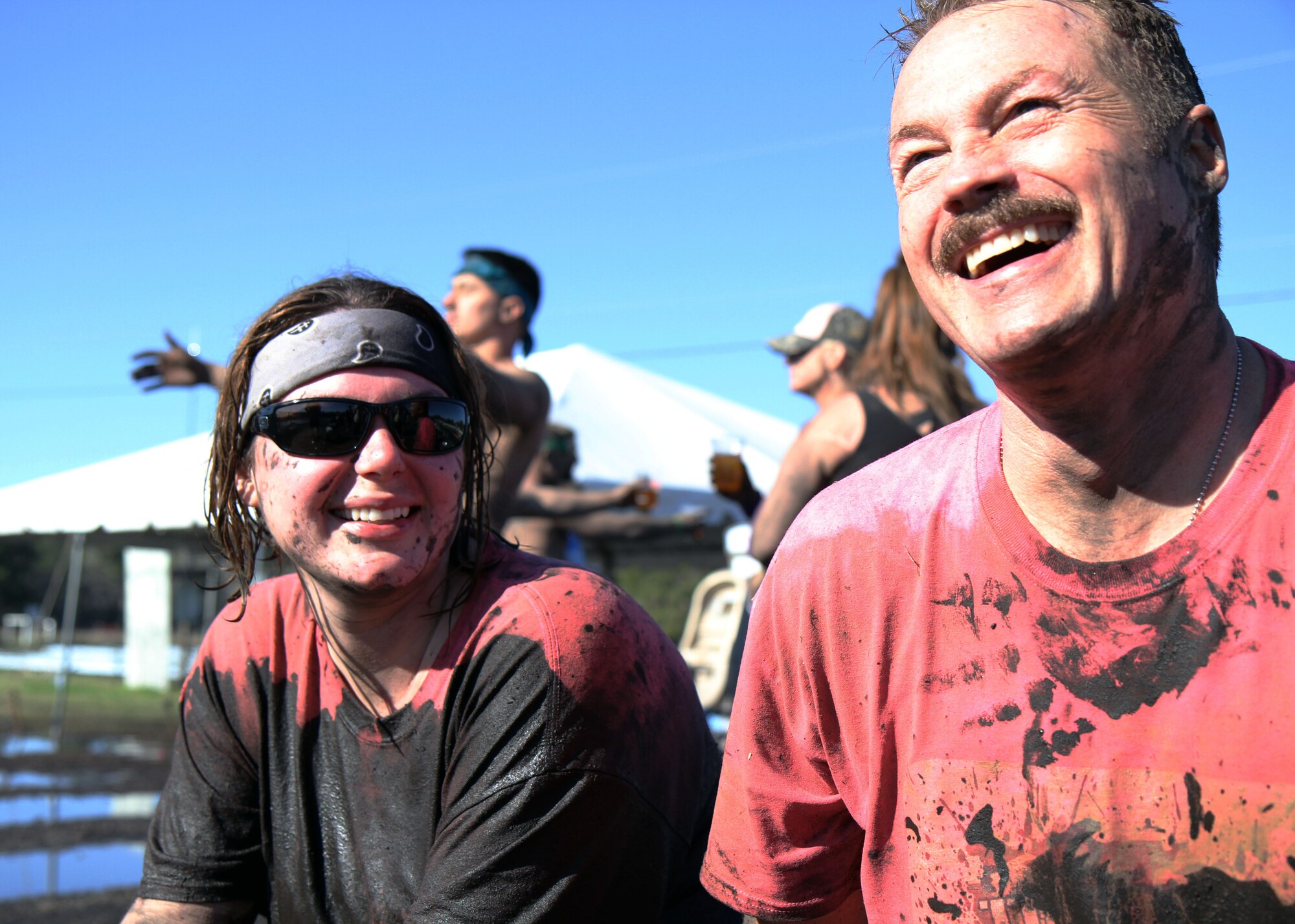 Master Sgt. Kyra Courtney (PLEASE DOUBLE CHECK NAME AND RANK!), finance manager with the 315th Force Support Squadron and mud run veteran, and Master Sgt. Larry Graybill, logistics plans NCO in charge with the 315th Logistics Readiness Squadron and mud run first-timer, share a laugh after completing the Rugged Maniac 5K mud challenge held March 8, 2014, at Boone Hall Farms in Mount Pleasant, S.C. Courtney and Graybill ran the obstacle-type race with the “Mudruckers,” a team of reservists serving with the 315th Airlift Wing at Joint Base Charleston, S.C. (U.S. Air Force photo by Senior Airman Meredith A. H. Thomas)