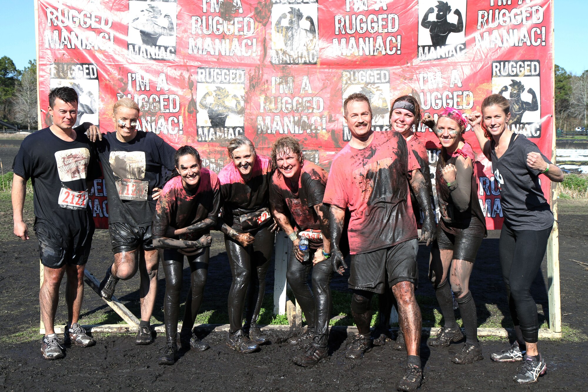 The “Mudruckers,” a group of reservists serving with the 315th Airlift Wing at Joint Base Charleston, S.C., show off their muddy physiques after completing the Rugged Maniac 5K mud run held March 8, 2014, at Boone Hall Farms in Mount Pleasant, S.C. This is the second obstacle-type challenge course the group has completed. (U.S. Air Force photo by Senior Airman Meredith A. H. Thomas)