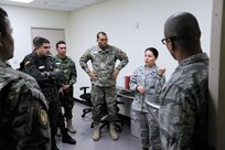 Inter-American Squadron Officer School students from Joint Base San Antonio-Lackland listen to a presentation in Spanish about the 359th Aerospace and Operational Physiology Training Unit’s Barany chair , March 11, at JBSA-Randolph. The chair, named for the Hungarian physiologist who invented it, is used demonstrate spatial disorientation and helps pilots understand why they must trust flight instruments over their own senses. The Inter-American Squadron Officer School is a professional military education course taught in Spanish to members of several Latin American federal agencies and U.S. Air Force captains.  There are 17 students from the U.S., Colombia, Panama and Guatemala in this class. The school is part of the 37th Training Wing’s Inter-American Air Forces Academy. (U.S. Air Force photo by Airman 1st class Alexandria Slade)
