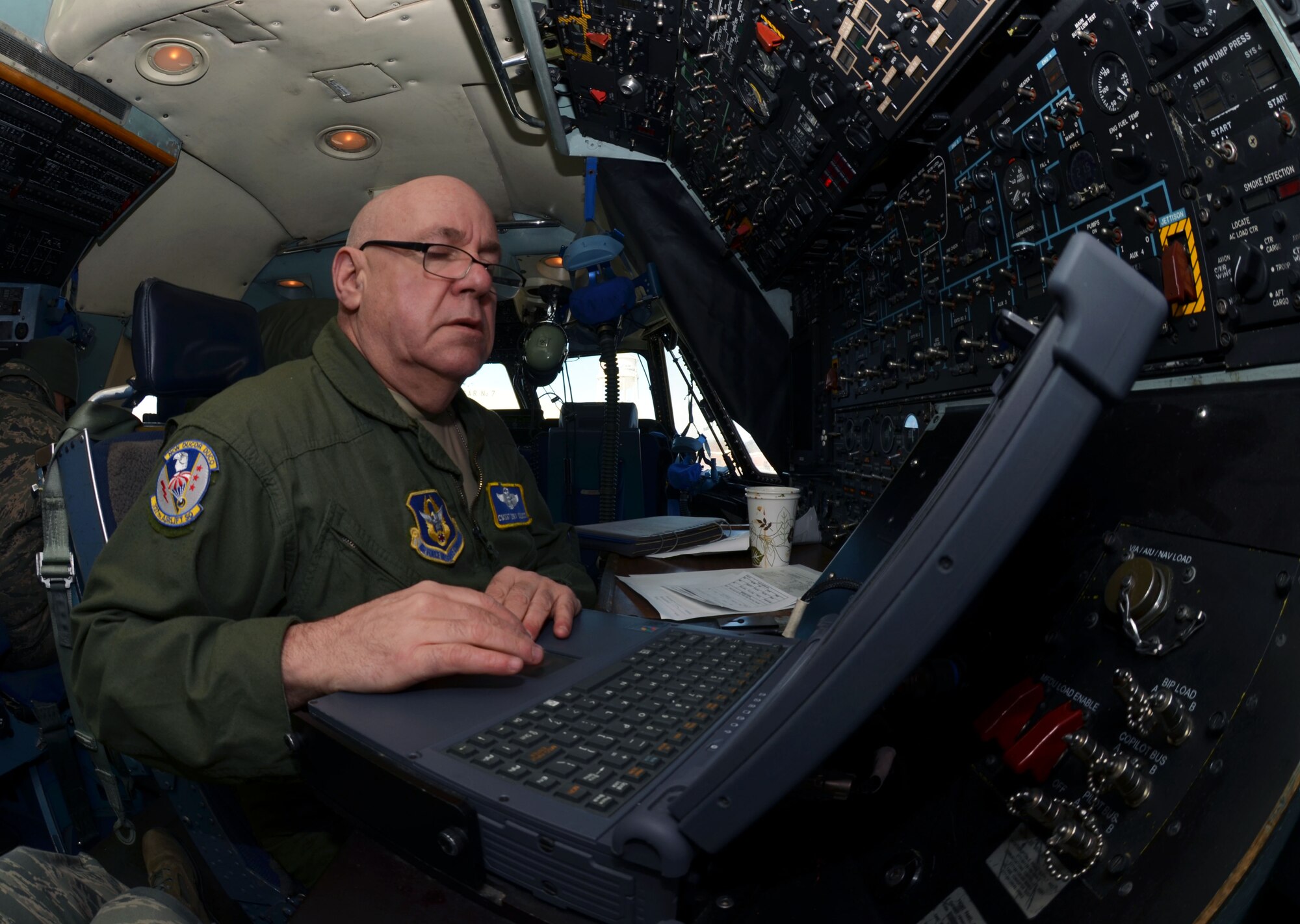 CMSgt. Anthony Colucci, 337th Airlift Squadron Flight Engineer, prepares the Patriot Wing C-5 Galaxy for departure, March 8, 2014. The 11-man Patriot Wing crew delivered 20 tons of humanitarian aid to Guatemala City, Guatemala, March 9. (U.S. Air Force photo/SSgt. Kelly Goonan) 