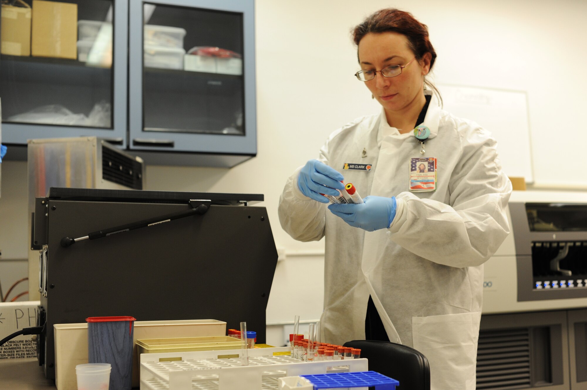 Irma Clark checks the information on blood samples at the Medical Clinic laboratory. Blood samples are drawn at the laboratory for shipping, immunology and chemistry testing. Clark is a 375th Medical Support Squadron lab technician. (U.S. Air Force photo/Airman 1st Class Megan Friedl)