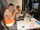 Airman 1st Class Alex Bernier and Staff Sgt. Lamont Class splice fiber optic cable in preparation to transfer communication equipment from a temporary shelter to a permanent facility at Joint Base Pearl Harbor-Hickam.  (Utah Air National Guard photo by MSgt. Mark Hoferitza/RELEASED)