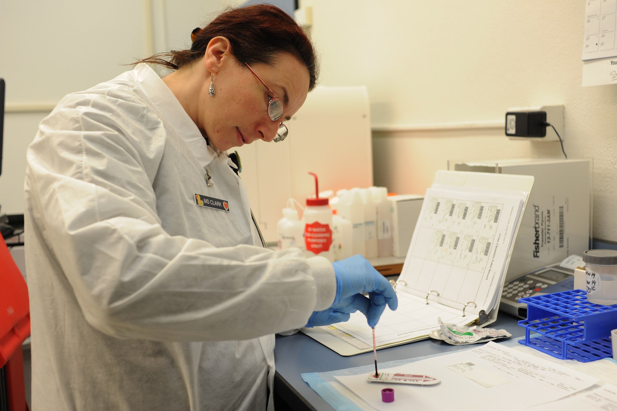 Scott Air Force Base technicians analyze medical samples in the laboratory. (U.S. Air Force photo/Airman 1st Class Megan Friedl)