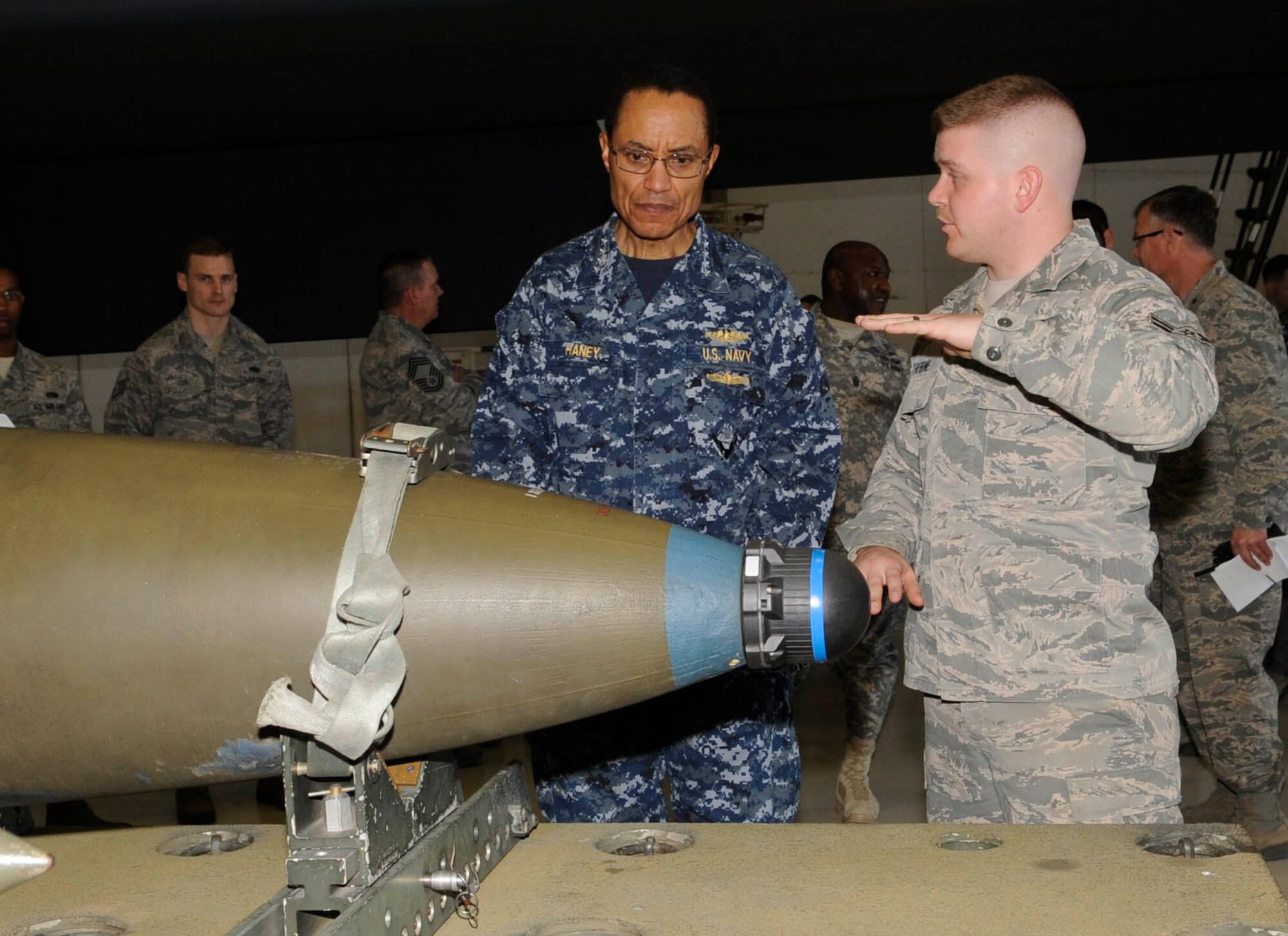Airman 1st Class James Thorne, 509th Munitions Squadron conventional maintenance crew member, explains the specifics of a 2,000-pound GBU-31 joint direct attack munition to U.S. Navy Adm. Cecil D. Haney, commander of U.S. Strategic Command, at Whiteman Air Force Base, Mo., March 10, 2014. During Haney’s visit here, he stressed the importance of Whiteman’s contributions to the command’s deterrence and assurance mission. (U.S. Air Force photo by Staff Sgt. Alexandra M. Boutte/Released)