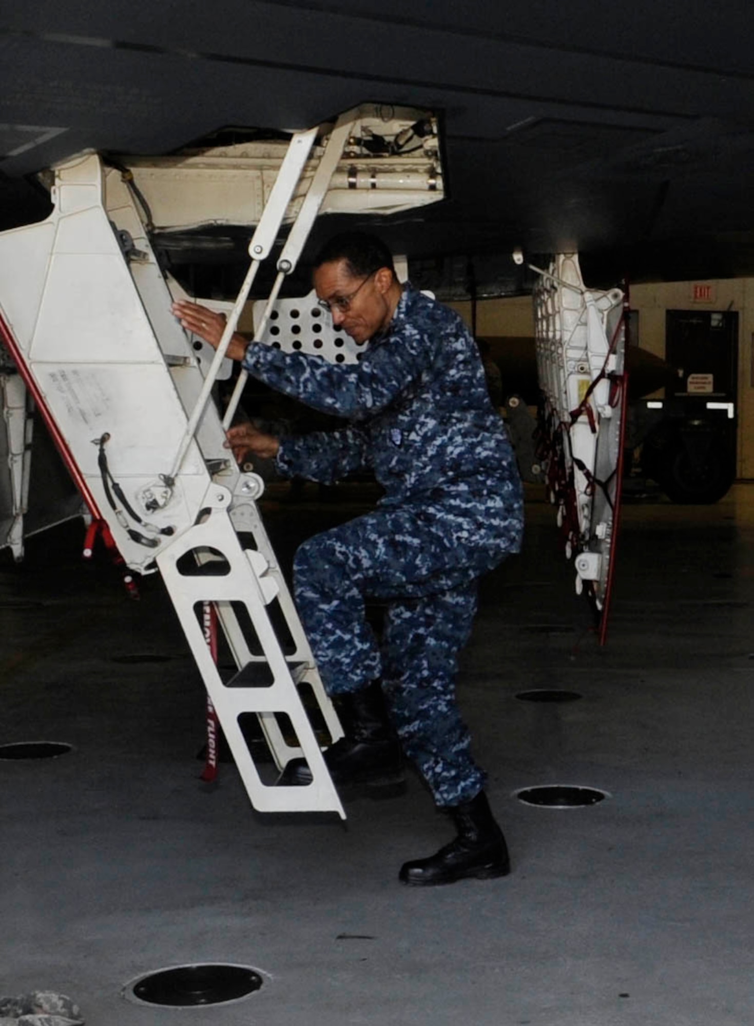 U.S. Navy Adm. Cecil D. Haney, commander of U.S. Strategic Command, climbs the ladder for a tour of the B-2 Spirit cockpit during his visit to Whiteman Air Force Base, Mo., March 10, 2014. The 509th Bomb Wing supports USSTRATCOM’s strategic deterrence mission by operating and maintaining B-2 Spirit bombers to deter strategic threats from adversaries and assure our allies of our commitment to their security. (U.S. Air Force photo by Staff Sgt. Alexandra M. Boutte/Released)