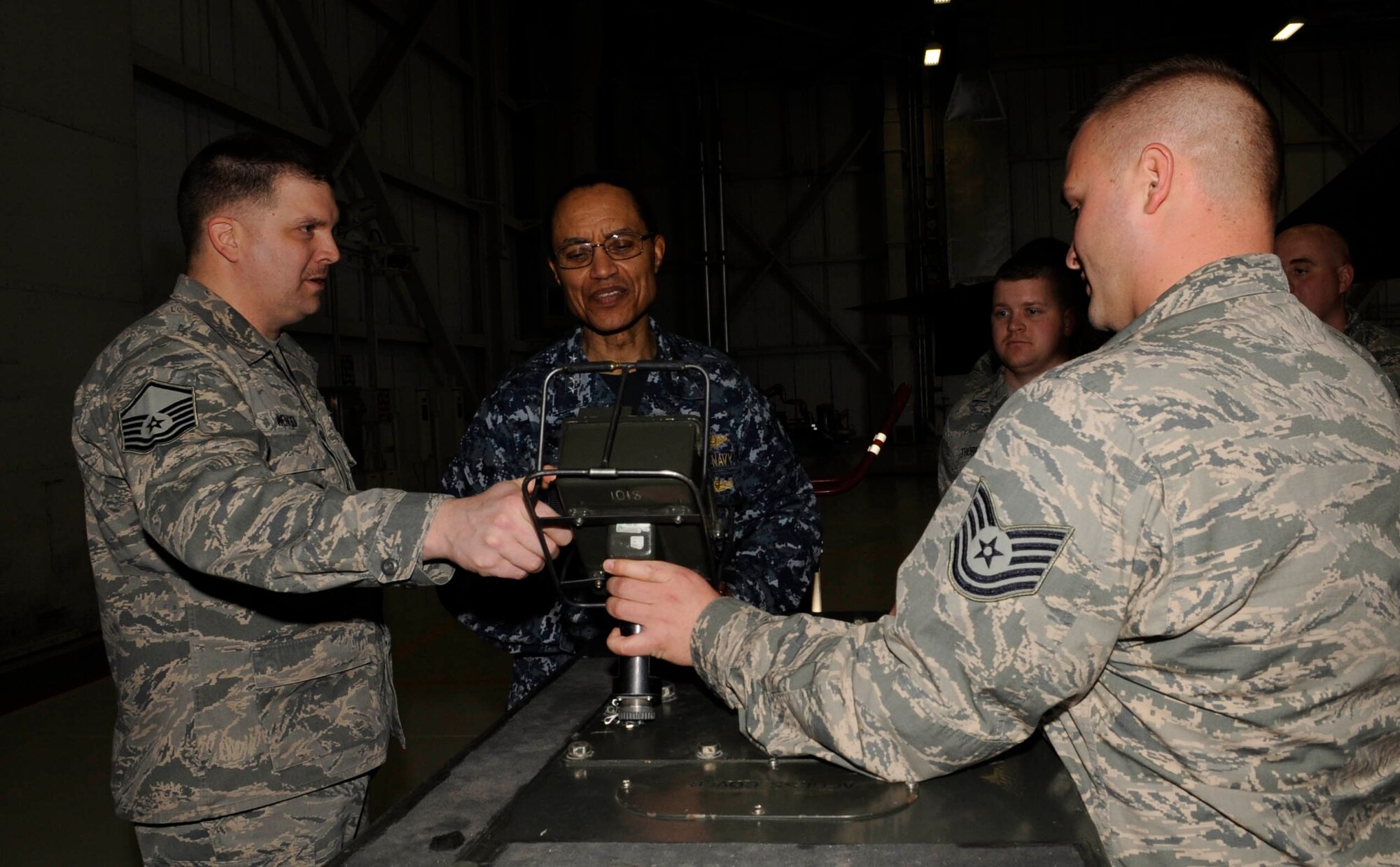 Members of the 509th Aircraft Maintenance Squadron and Munitions Squadron explain the specifics of a MHU-204 portable control unit to U.S. Navy Adm. Cecil D. Haney, commander of U.S. Strategic Command, Whiteman Air Force Base, Mo., March 10, 2014. During Haney’s visit here, he stressed the importance of Whiteman’s contributions to our nation’s deterrence mission. (U.S. Air Force photo by Staff Sgt. Alexandra M. Boutte/Released)