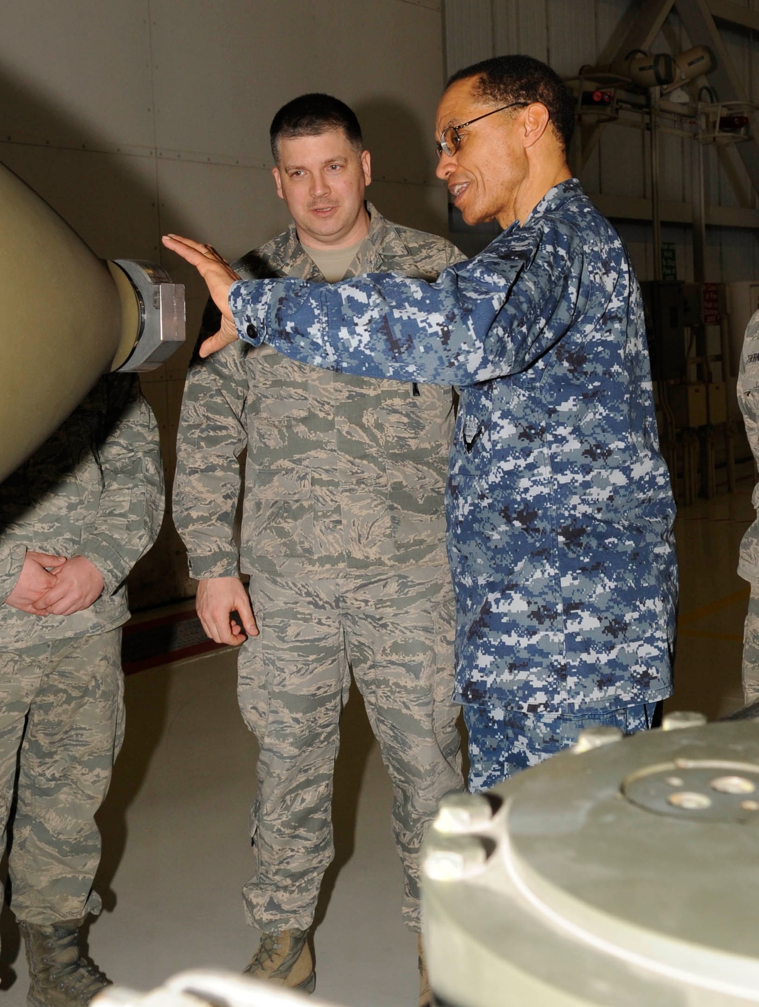 U.S. Air Force Master Sgt. Cory Wenger, 509th Aircraft Maintenance Squadron section chief, explains the specifics of a conventional weapon to U.S. Navy Adm. Cecil D. Haney, commander of U.S. Strategic Command, at Whiteman Air Force Base, Mo., March 10, 2014. USSTRATCOM relies on various task forces for the execution of its global missions, including space operations, information operations, missile defense, global command and control, intelligence, surveillance and reconnaissance, global strike and strategic deterrence and combating weapons of mass destruction. (U.S. Air Force photo by Staff Sgt. Alexandra M. Boutte/Released)