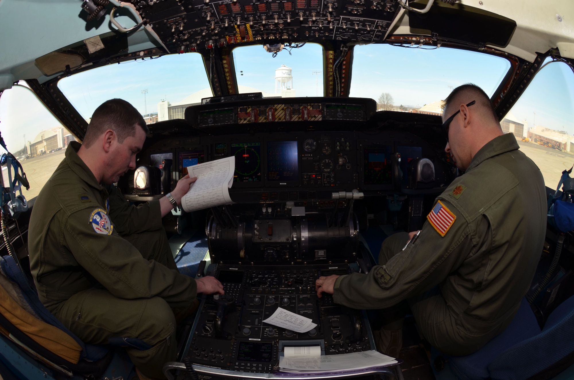 1st Lt. Eric Rossi and Maj. Scott Kuhrt, 337th Airlift Squadron, prepare the C-5 Galaxy for departure from Westover, March 8, 2014. The 11-man Patriot Wing crew delivered 20 tons of humanitarian aid to Guatemala City, Guatemala, March 9. (U.S. Air Force photo/SSgt. Kelly Goonan) 