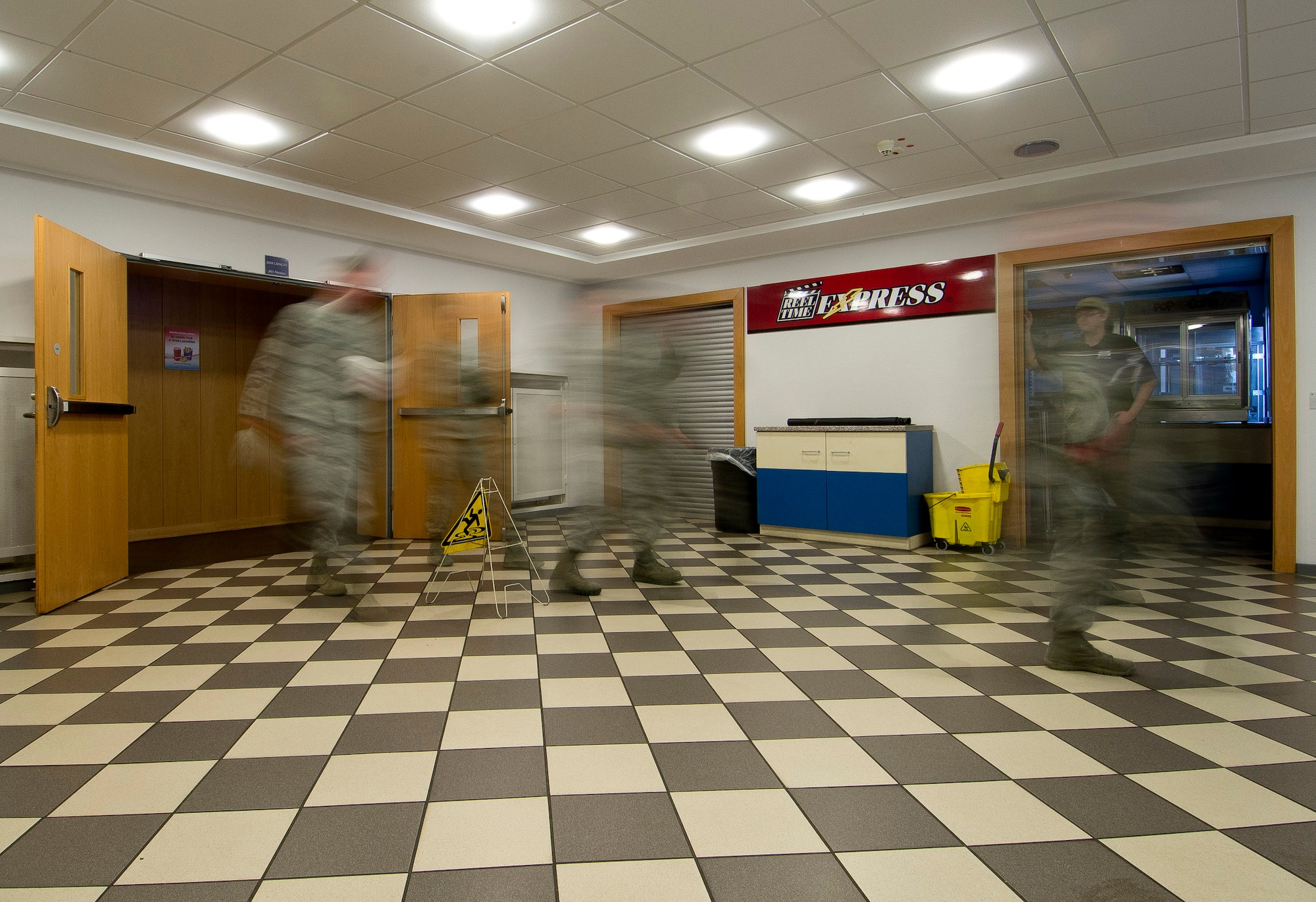 Patrons exit the Skyline Theater auditorium after the showing of the World War II documentary "Ghost Army" at Spangdahlem Air Base, Germany, March 11, 2014. The film chronicles a secret U.S. Army unit dedicated to misleading and deceiving enemy forces using tactics such as recorded battle sounds, inflatable tanks and false radio broadcasts. (U.S. Air Force photo by Staff Sgt. Chad Warren/released)