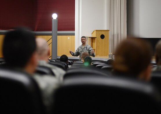 U.S. Air Force Col. David Julazadeh, 52nd Fighter Wing commander, speaks to the audience before the start of the documentary "Ghost Army" in the Skyline Theater at Spangdahlem Air Base, Germany, March 11, 2014. The World War II documentary tells the story of a secret U.S. Army unit designed to mislead and deceive the enemy using recorded sounds, inflatable tanks and false radio transmissions. (U.S. Air Force photo by Staff Sgt. Chad Warren/released)