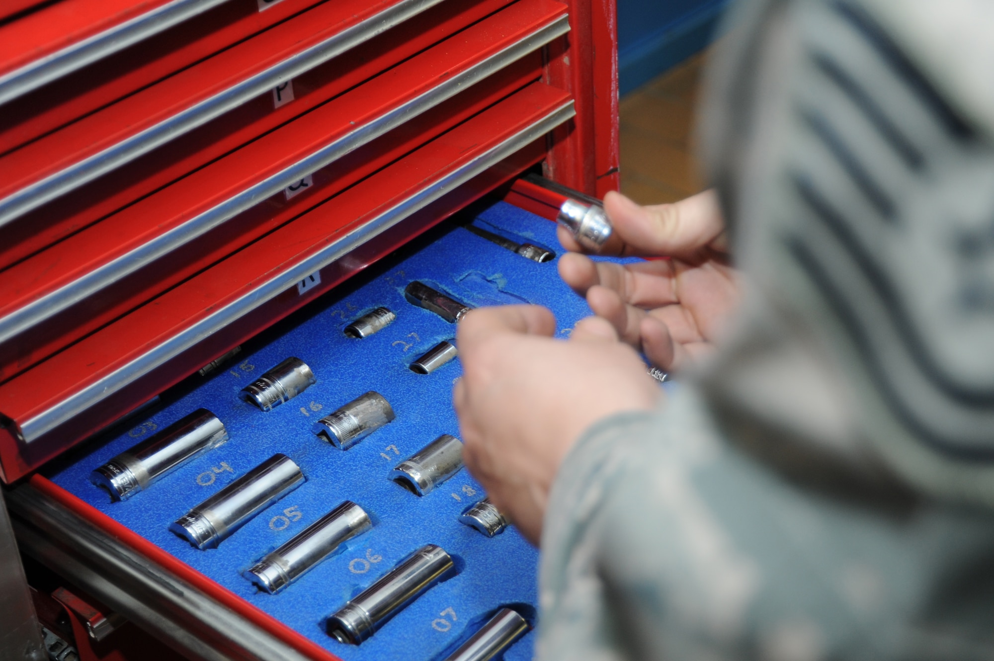 U.S. Air Force Tech. Sgt. Kristina Green, 52nd Equipment Maintenance Squadron conventional munitions maintenance assistant NCO in charge from Vallejo, Calif., inspects tools March 10, 2014, at Spangdahlem Air Base, Germany. An inventory must be completed every time a drawer is opened for accountability of the tools. (U.S. Air Force photo by Airman 1st Class Dylan Nuckolls/Released)