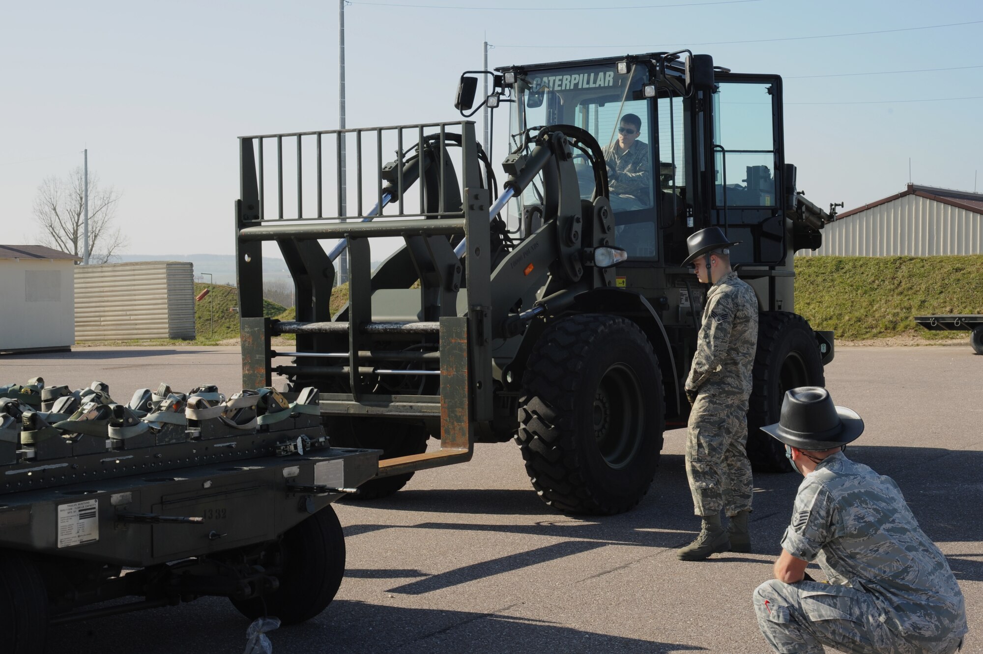 Airmen from the 52nd Equipment Maintenance Squadron, unload a munitions trailer in preparation for an inspection March 10, 2014, at Spangdahlem Air Base, Germany. Unstacked trailers must be inspected three times within the same time frame as stacked trailers. (U.S. Air Force photo by Airman 1st Class Dylan Nuckolls/Released)