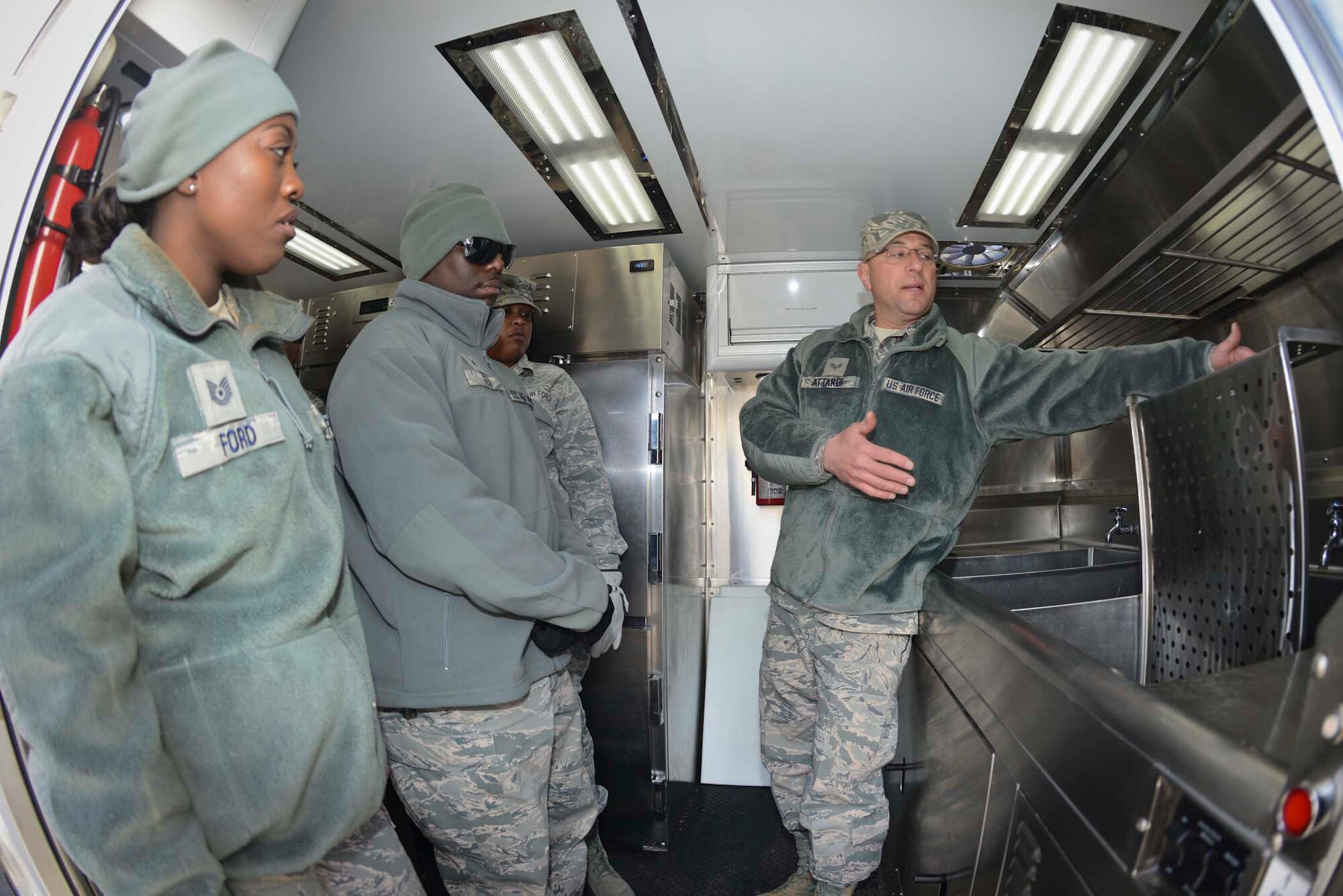 U.S. Air Force Senior Airmen Gino Attardi, 136th Force Support Squadron, Services Flight, Texas Air National Guard, demonstrates the functionality of a newly assigned Disaster Relief Mobile Kitchen Trailer (DRMKT) to members of the 116th Force Support Squadron, Services Flight, Georgia Air National Guard, Robbins AFB, at Naval Air Station Fort Worth Joint Reserve Base, Texas, Feb. 22, 2014. Members of the 116th FSS/FSV participated in the two-day training event in anticipation of receiving their own DRMKT in July 2014. (Air National Guard photos by Master Sgt. Charles Hatton/Released)