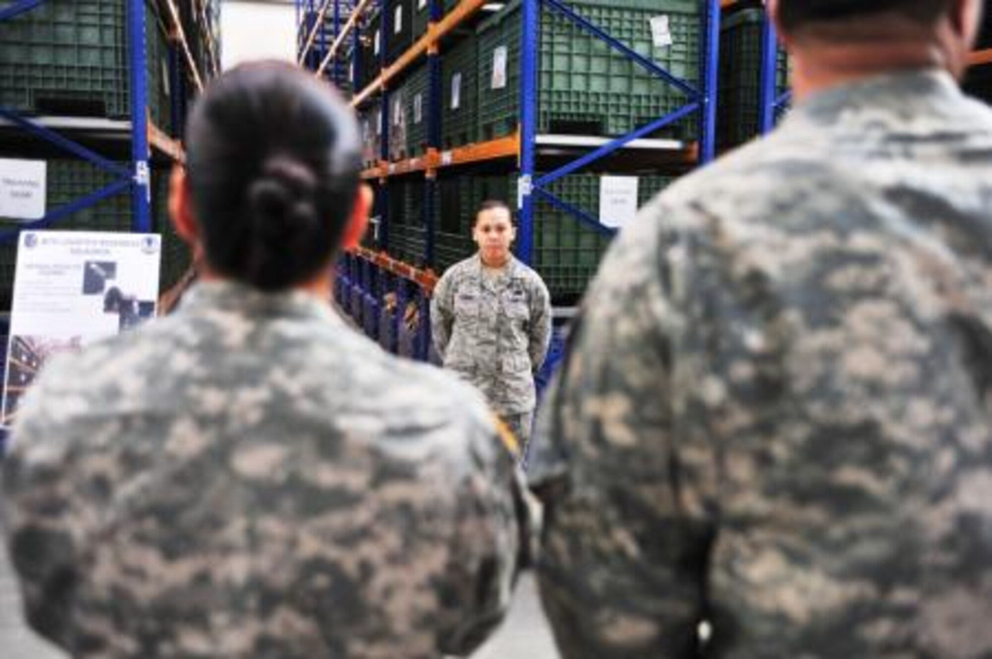 Air Force Airman 1st Class Vanessa R. Zapata, a material management journeyman assigned to the 86th Logistic Readiness Group and a native of Covina, Calif., briefs Soldiers from the 21st Theater Sustainment Command on the mission of the 86th LRG deployment distribution facility during a visit to Ramstein Airbase March 7. (U.S. Army photo/Staff Sgt. Alexander Burnett)
