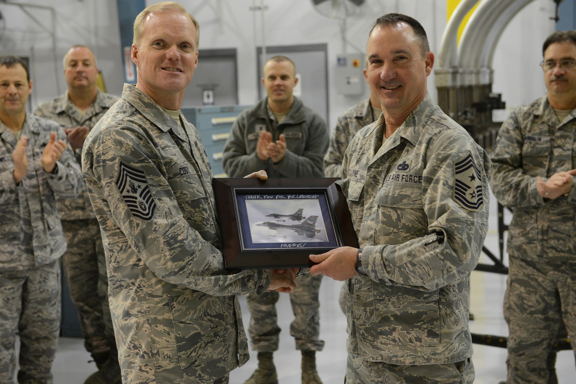 Chief Master Sergeant of the Air Force James A. Cody receives a token of appreciation from 138th Fighter Wing Command Chief Master Sergeant Tom Payne, during his  visit to the 138th Fighter Wing, Tulsa Air National Guard, March 7, 2014.  Cody and his wife Athena, along with Air Force Chief of Staff Gen. Mark A. Welsh III and his wife, Betty, held an Airman’s Call and luncheon during their visit.  (U.S. National Guard photo by Senior Master Sgt.  Preston L. Chasteen/Released)
