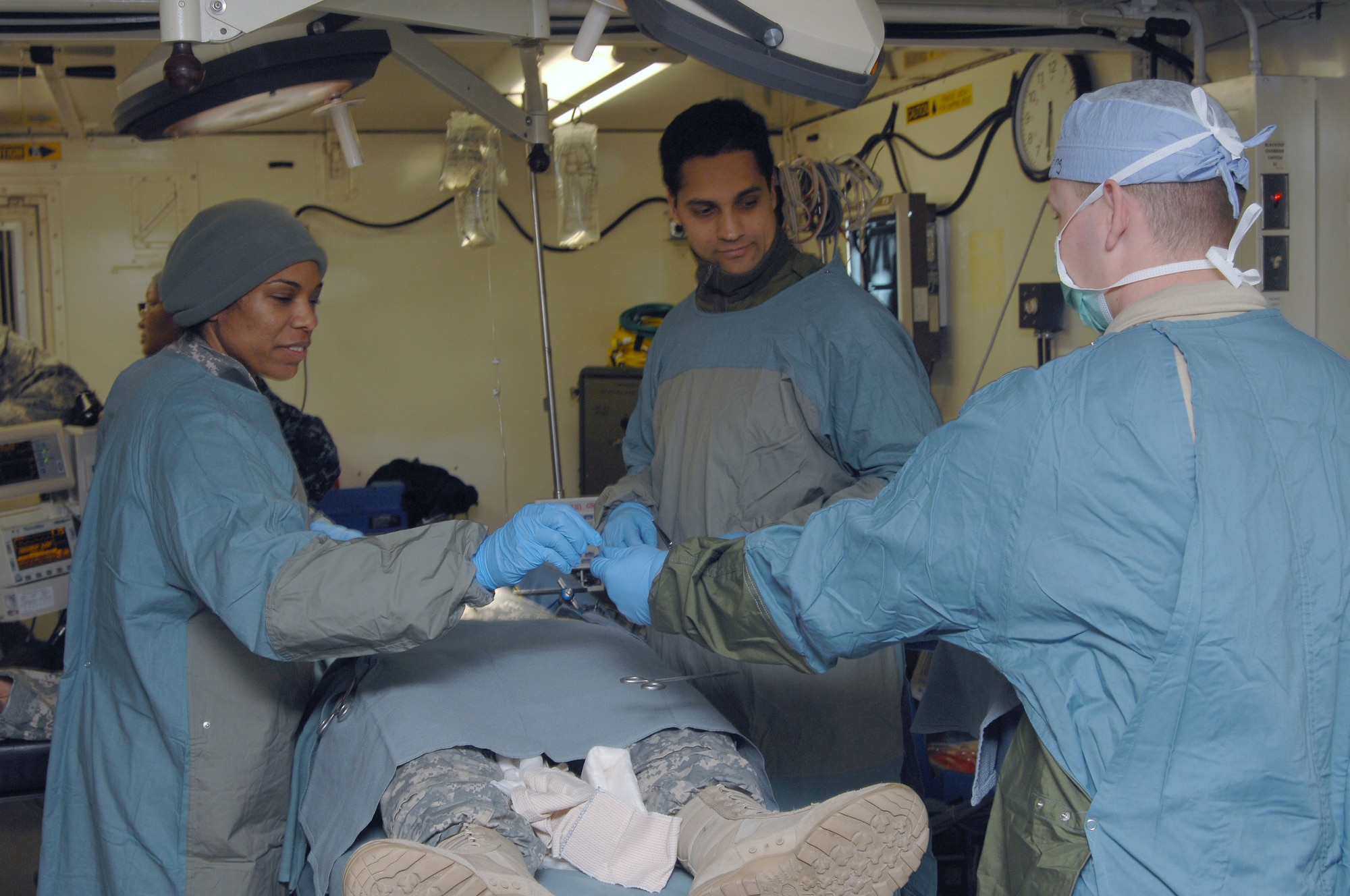 Lt. Col. Malene Inram, from Schnectady, N.Y., and a general surgeon with the 365th Combat Support Hospital, Utica, N.Y., and Maj. Gerard Slobogean, an orthopedic surgeon from Vancouver, Canada, conducts an assessment on a simulated patient, with Spc. Alan Dollino, of Syracause, N.Y., during Global Medic Excercise at Joint Base McGuire-Dix-Lakehurst, N.J. The medical excercise was a part of the Army Reserves Combat Support Training Excercise led by the 78th Training Division. The 365th operated in field hospital equipped like a U.S. trauma center, working with all branches of the military to include Canadian military reserve medical professionals. (U.S. Army photo by Master Sgt. David Moore/Released)