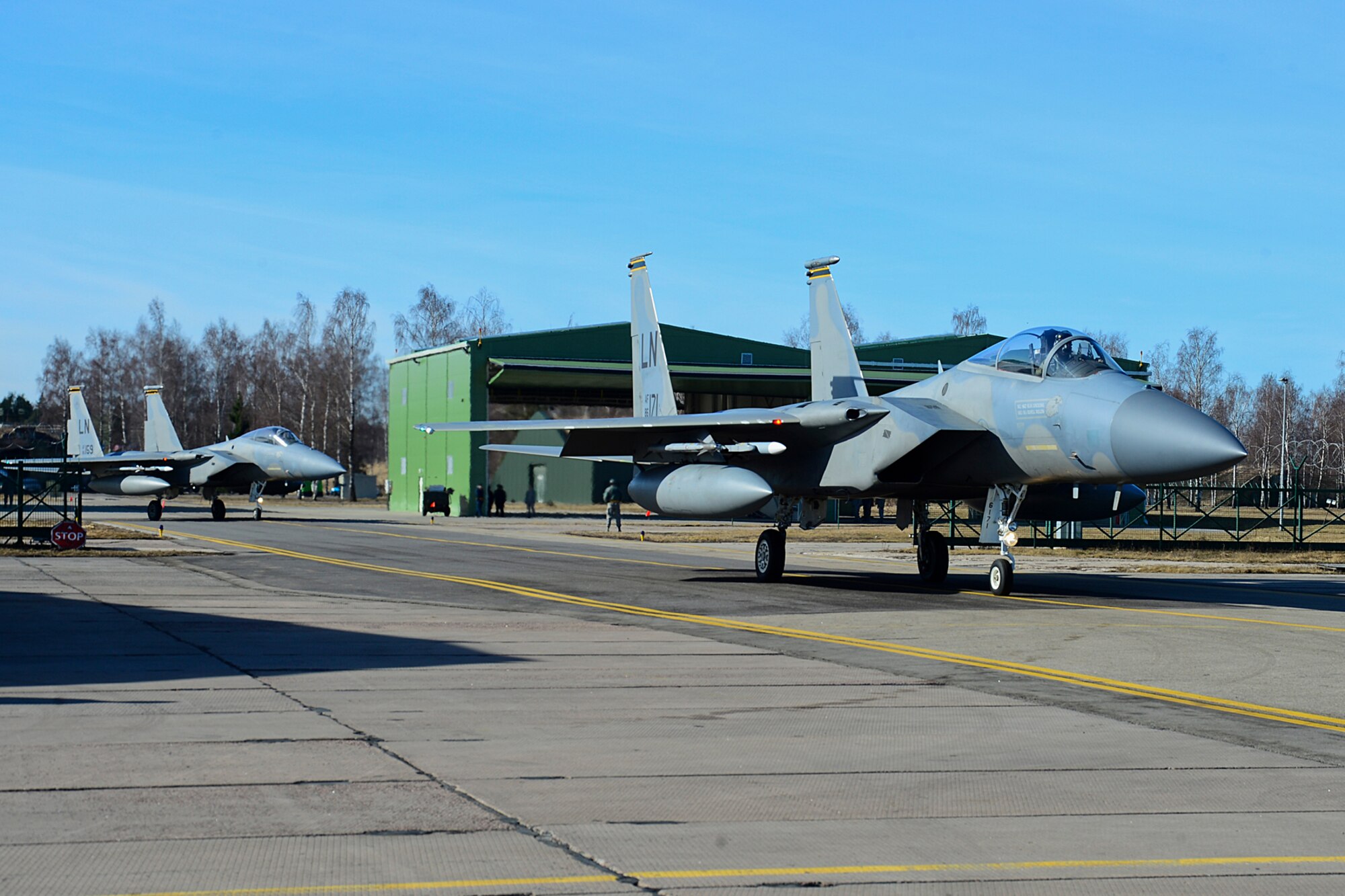 Two F-15C Eagles taxi to the runway at Šiauliai Air Base, Lithuania March 11, 2014. The F-15C Eagles flew over the city of Šiauliai as part of the area’s celebrations for the Day of Restoration of Independence. This year’s events mark 24 years since Lithuania declared independence from the Soviet Union. (U.S. Air Force photo by Airman 1st Class Dana J. Butler)