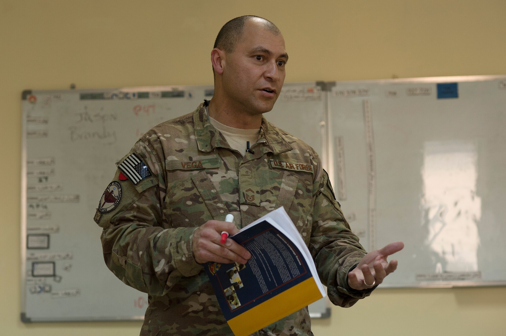 U.S. Air Force Senior Master Sgt. Carmelo Vega Martinez, 438th Air Expeditionary Wing/NATO Air Training Command-Afghanistan recruiting adviser, teaches Afghan Air Force Airmen the English language during a class, Feb. 23, 2014, Kabul, Afghanistan. When not volunteering to teach English, Vega Martinez advises the Afghan Air Force on how to establish and sustain a recruiting service. Vega Martinez, a Ponce, Puerto Rico native, is deployed from the 368th Recruiting Squadron, Hill Air Force Base, Utah. Airmen from the 438th AEW/NATC-A are playing a vital role in Operation Enduring Freedom as advisers tasked with aiding the Afghan government in establishing an operational and sustainable Afghan Air Force. (U.S. Air Force photo by Tech. Sgt. Jason Robertson/Released)