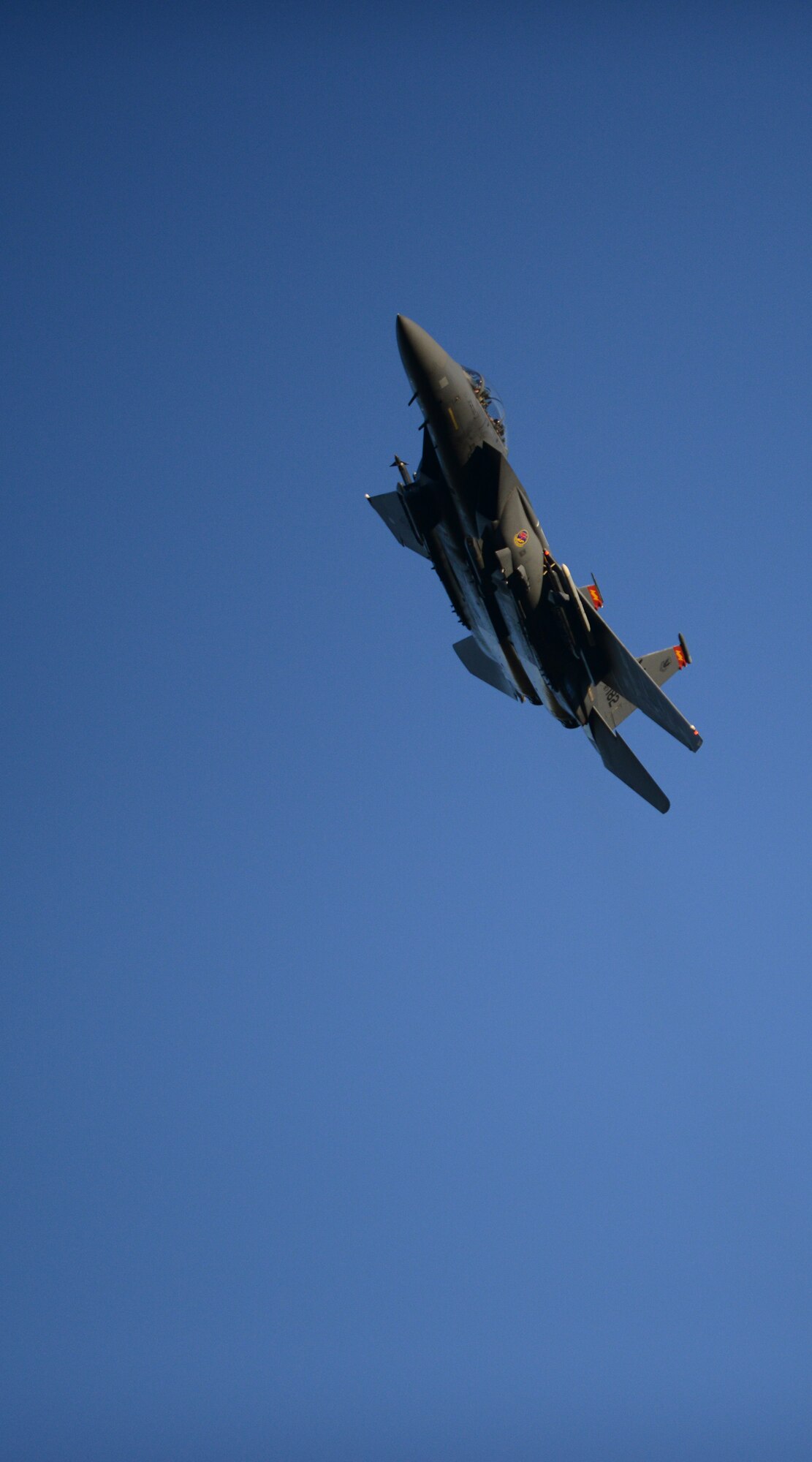 An F-15E Strike Eagle passes by after a simulated air strike during Gunfighter Flag at Saylor Creek bombing range near Mountain Home Air Force Base, Idaho, March 11, 2014. Mountain Home AFB has one of the top range complexes in the United States. (U.S. Air Force photo by Airman 1st Class Malissa Lott/RELEASED)