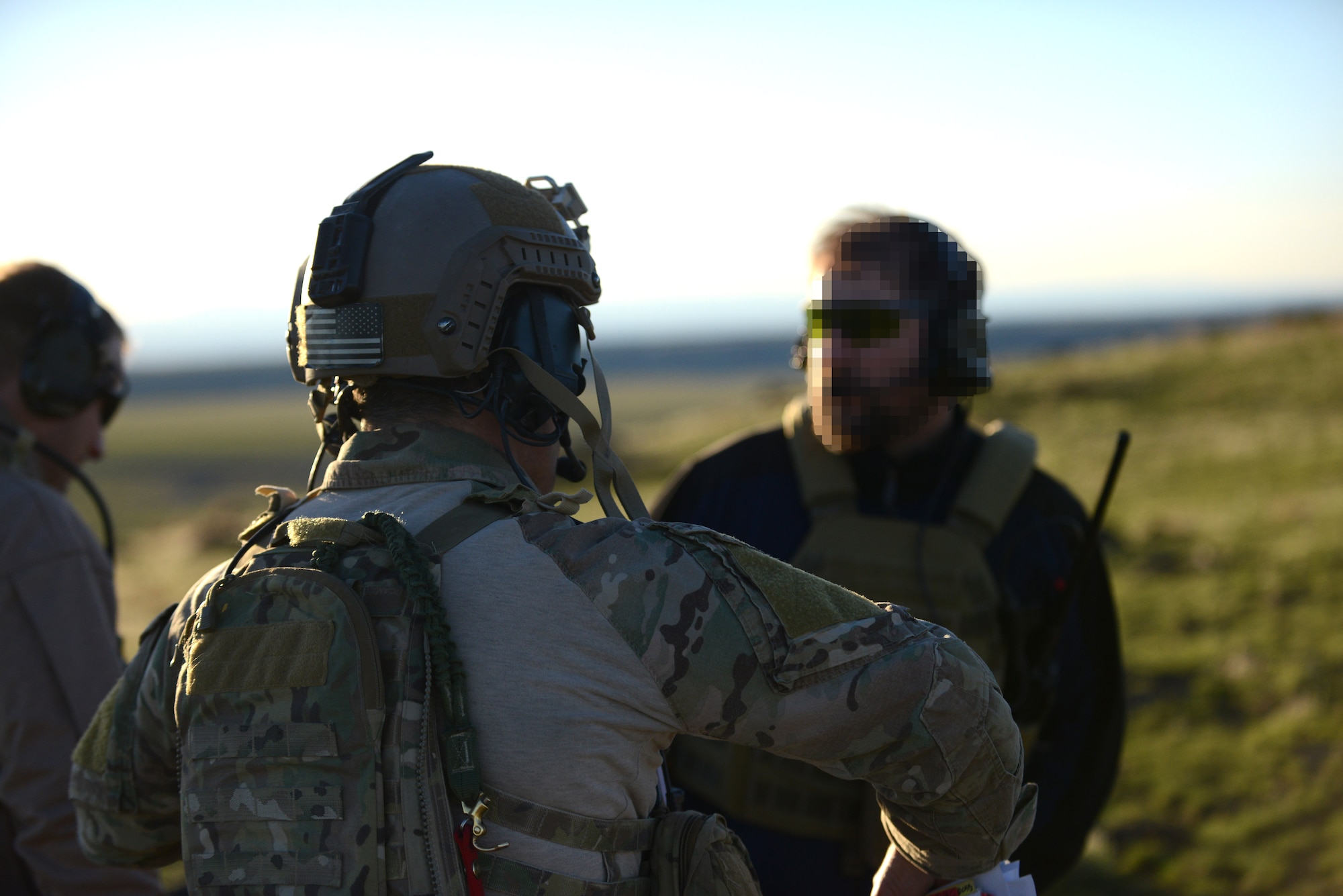 A group of combat controllers discuss their strategies at Saylor Creek bombing range near Mountain Home Air Force Base, Idaho, March 11, 2014. Members from various services simulated close air support during Gunfighter Flag, a week-long exercise focusing on joint force operations. (U.S. Air Force photo by Airman 1st Class Malissa Lott/RELEASED)