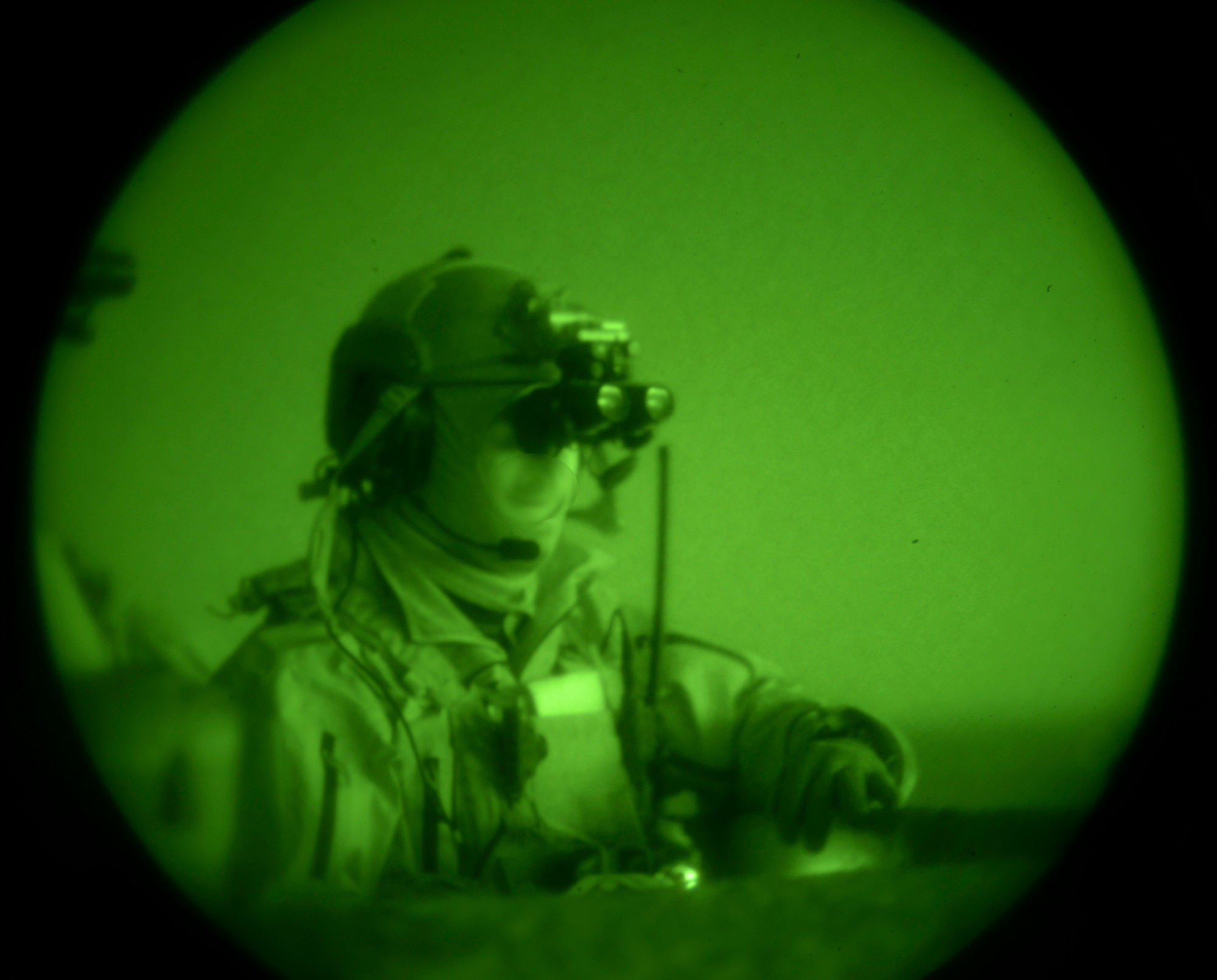 An Air Force combat controller watches a successful exercis bomb drop at Saylor Creek Range at Mountain Home Air Force Base, Idaho, March 11, 2014. Realistic training provides the U.S. and partnered warfighter with the combat edge. Mountain Home Air Force Base has the right mix of air space, modern ranges and proficient personnel, which makes this base and our ranges the perfect location for this type of combined-joint training. The CCT’s identity is masked. (U.S. Air Force photo by Master Sgt. Kevin Wallace/RELEASED)