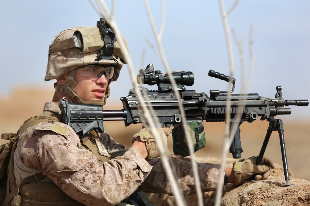 U.S. Marine Corps Lance Cpl. Cody Kovnesky provides security during a ...