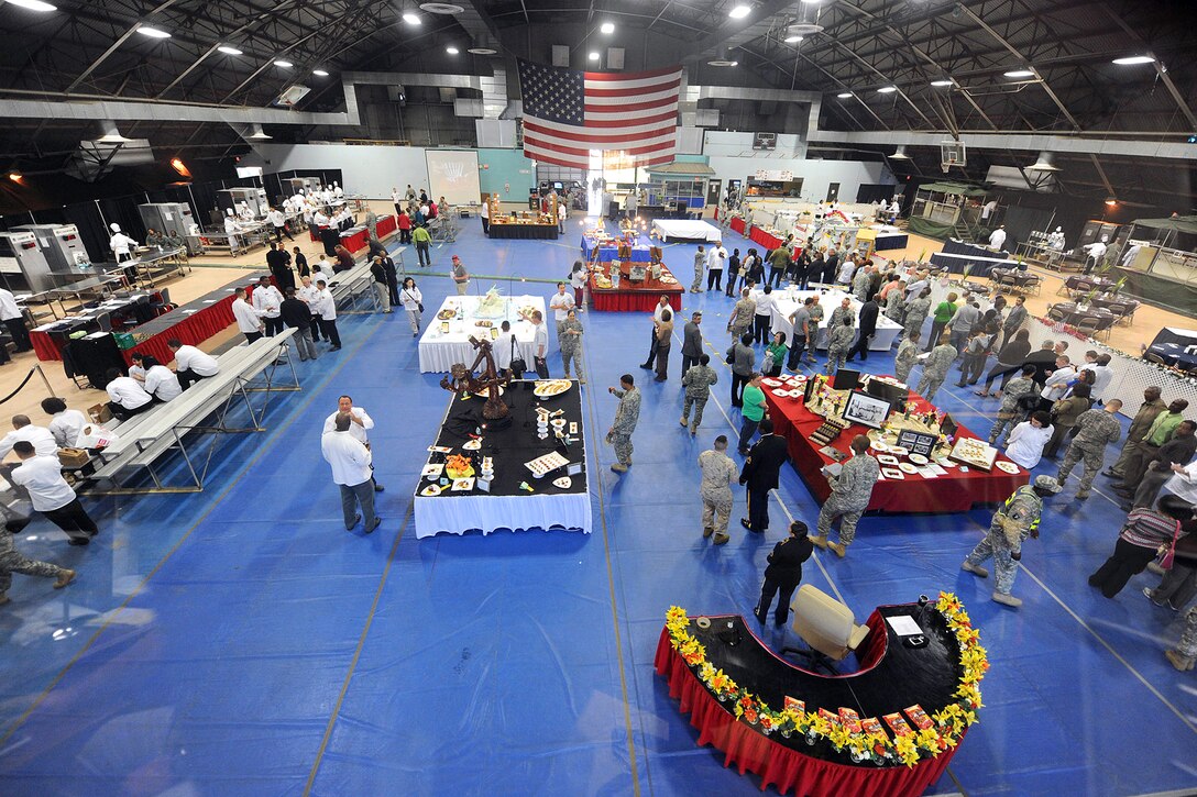 Competitors and visitors enjoy the culinary displays created by culinary arts team members during the 2014 Military Culinary Arts Competition held on Fort Lee, Va., March 11, 2014.