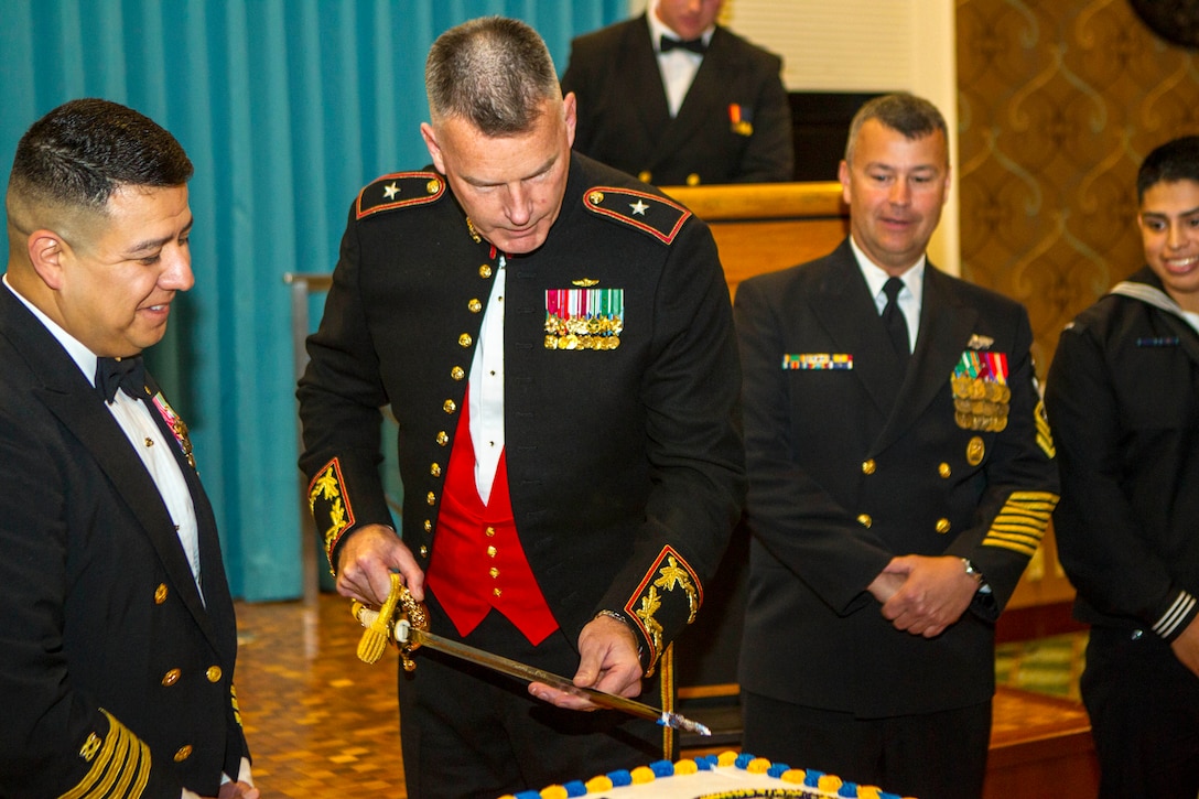 Brig. Gen. Niel E. Nelson cuts into a birthday cake March 8 at the Crow’s Nest on Camp Shields during the Seabee and Civil Engineer Corps’ anniversary celebration. This year marks the 72nd Seabee and 147th CEC anniversary. Nelson was the guest of honor for the evening and made the traditional first cut into the birthday cake. He spoke about the history and future of the Seabees and commended them for their dedicated service to mission accomplishment. Nelson is the commanding general of 3rd Marine Logistics Group, III Marine Expeditionary Force.
