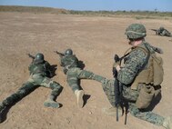 Two Senegalese Commandos sight in on a target as Cpl. Justin Schweig, a Marine with Special-Purpose Marine Air-Ground Task Force Africa 14.1, observes during a live-fire range. A team of U.S. Marines trained and advised their counterparts from the Companie de Fusilier Marine Commandos in Senegal during February in support of U.S. Marine Forces Europe and Africa and U.S. Africa Command’s mission to assist partner nations in addressing their security challenges.