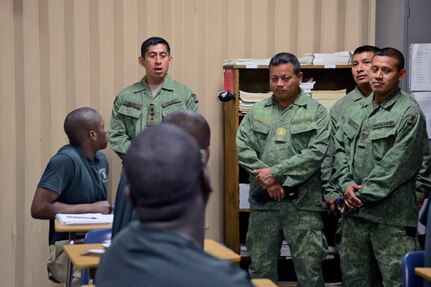 Capt. Marco Salam, member of the Belize Defence Force, visits with cadets at Camp Beauregard's Youth ChalleNGe Program, in Pineville, La., Feb. 18, 2014.
