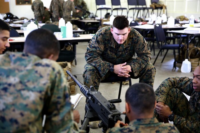 Sergeant Zachary Wolf, a machine gunners course instructor, 1st Marine Division Schools, and a native of Klamath Falls, Ore., observes Marines with 1st Reconnaissance Battalion, during a practical application exercise aboard Marine Corps Base Camp Pendleton, Calif., Feb. 27, 2014. During the eight-day course Marines learned the characteristics and the effective implementation of four weapon systems. The practical skills Marines learn during the course help enable them to be effective under a variety of combat scenarios.