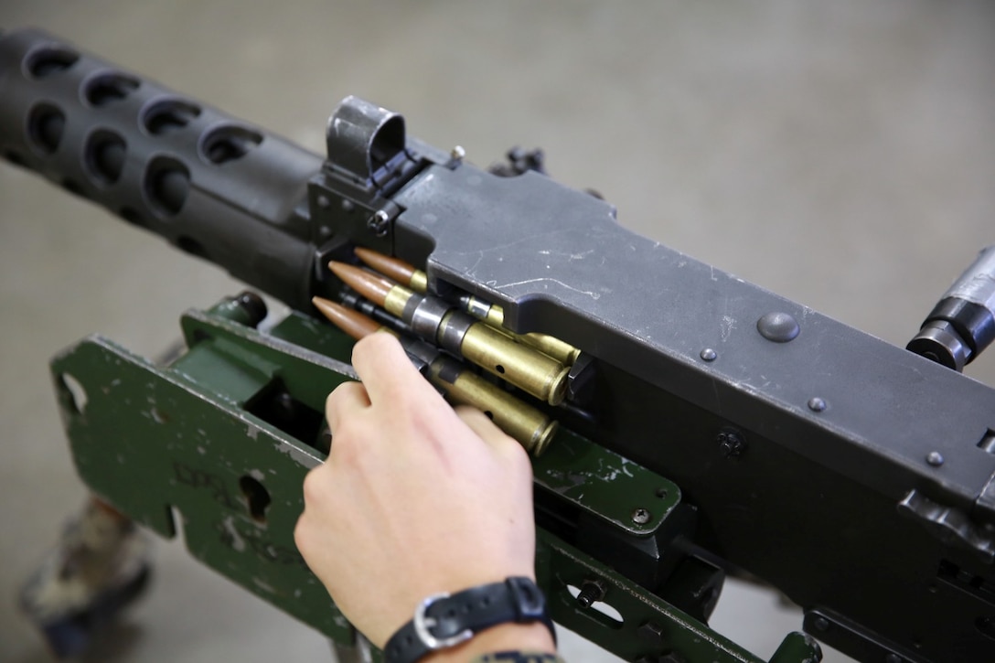 A Marine with 1st Reconnaissance Battalion works with a .50 caliber machine gun during a practical application exercise as part of the machine gunners course aboard Marine Corps Base Camp Pendleton, Calif., Feb. 27, 2014. During the eight-day course Marines learned the characteristics and the effective implementation of four weapon systems. The practical skills Marines learn during the course help enable them to be effective under a variety of combat scenarios.