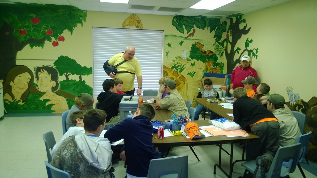 Mark Dixson, a supervisory electrical engineer with the Little Rock District, explains his specialty to a group of Cub Scouts at a science, technology, engineering and mathematics event in Bryant, Ark.  Dixson showed the Scouts how to produce an electrical circuit with a battery.

“I have worked with the Boy and Cub Scouts for more than 20 years,” said Dixson. “I believe I get more enjoyment out of teaching them, than what the Scouts get by learning about electrical engineering.”
