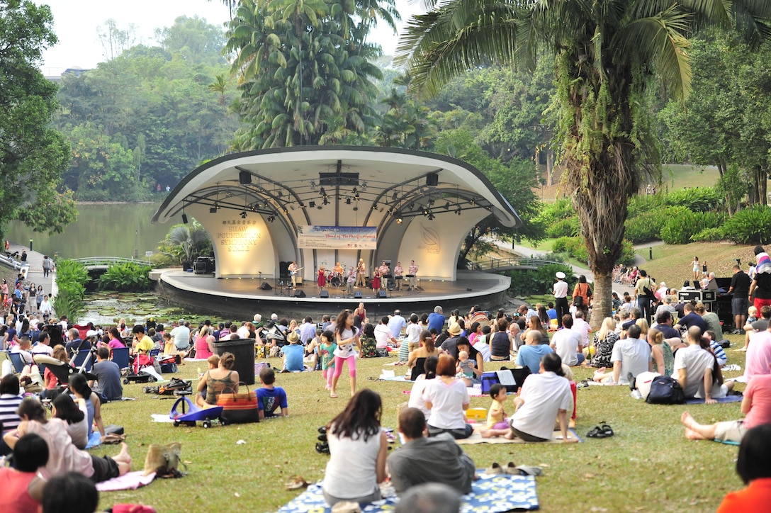 CHANGI, Singapore-- "Hana Hou!" performs for a large audience on the lawn at the Singapore Botanic Garden, Feb. 15, 2014. The group played 9 shows to over 100K audience members throughout their tour. The Band of the Pacific-Hawaii went to Singapore in support of the air show, the U.S. Embassy, and to improve international relations. (US Air Force Photo/ SrA Andy Detra/released)