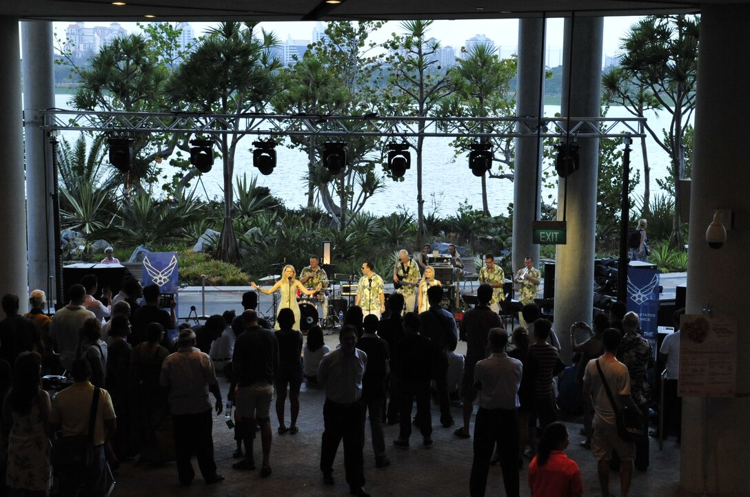 CHANGI, Singapore-- "Hana Hou!" performs at the Gardens By the Bay, Feb. 13, 2014. The group played 9 shows to over 100K audience members throughout their tour. The Band of the Pacific-Hawaii went to Singapore in support of the air show, the U.S. Embassy, and to improve international relations. (US Air Force Photo/ SrA Andy Detra/released)
