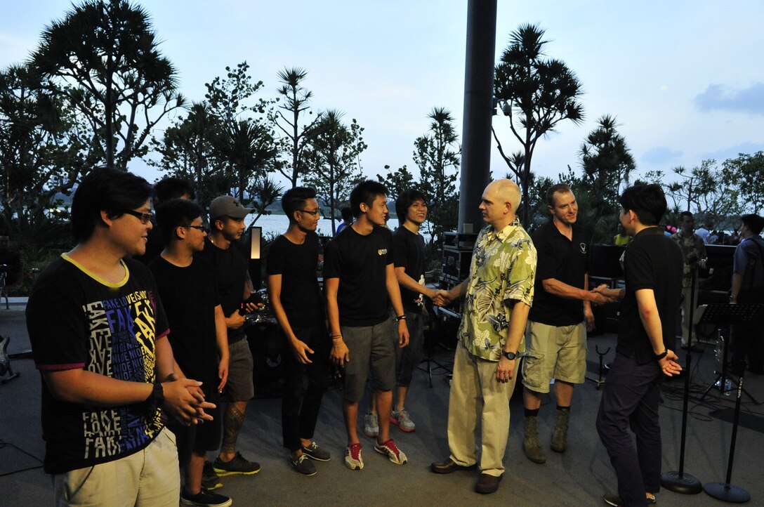 CHANGI, Singapore-- TSgt Michael Smith and SSgt BJ Richard hangs out with the sound technicians at the Gardens By the Bay, Feb. 13, 2014. The group played 9 shows to over 100K audience members throughout their tour. The Band of the Pacific-Hawaii went to Singapore in support of the air show, the U.S. Embassy, and to improve international relations. (US Air Force Photo/ SrA Andy Detra/released)