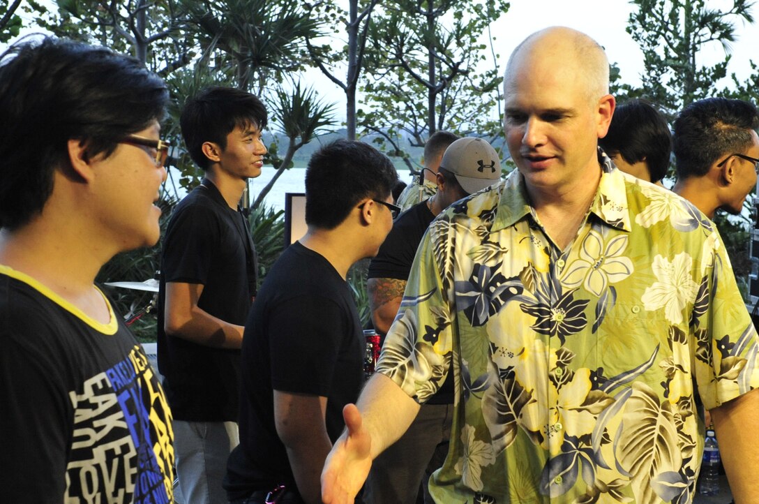 CHANGI, Singapore-- TSgt Michael Smith greets the sound technicians at the Gardens By the Bay, Feb. 13, 2014. The group played 9 shows to over 100K audience members throughout their tour. The Band of the Pacific-Hawaii went to Singapore in support of the air show, the U.S. Embassy, and to improve international relations. (US Air Force Photo/ SrA Andy Detra/released)