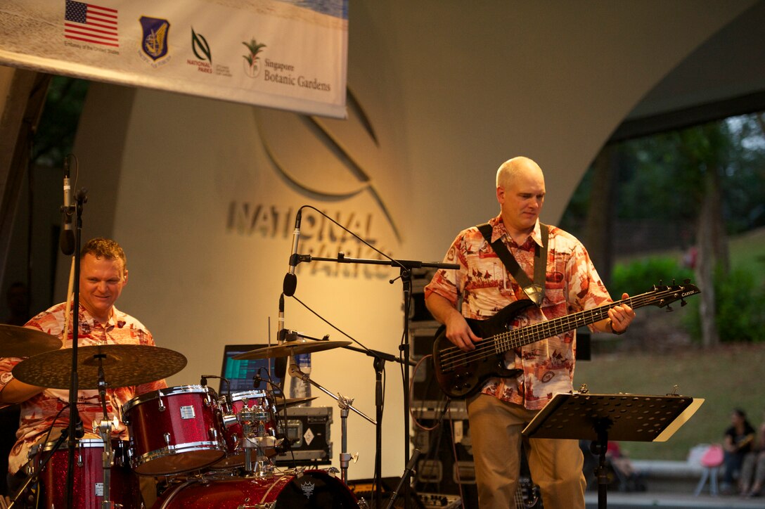 CHANGI, Singapore-- SSgt Troy Griffin (drums) and TSgt Michael Smith (bass), performs at the Botanic Garden in Singapore! TSgt Smith is usually our sound engineer, but filled in on bass and did a fantastic job! We are fortunate to have some very talented people in our unit! The group played 9 shows to over 100K audience members throughout their tour. The Band of the Pacific-Hawaii went to Singapore in support of the air show, the U.S. Embassy, and to improve international relations. (US Air Force Photo/ SrA Andy Detra/released)
