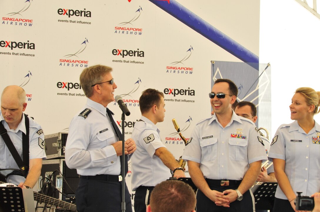 CHANGI, Singapore-- The PACAF Commander, General Carlisle, thanks the Band of the Pacific-Hawaii at the Singapore Air Show ,Feb. 12, 2014.The group played 9 shows to over 100K audience members throughout their tour. The Band of the Pacific-Hawaii went to Singapore in support of the air show, the U.S. Embassy, and to improve international relations. (US Air Force Photo/ SrA Andy Detra/released)