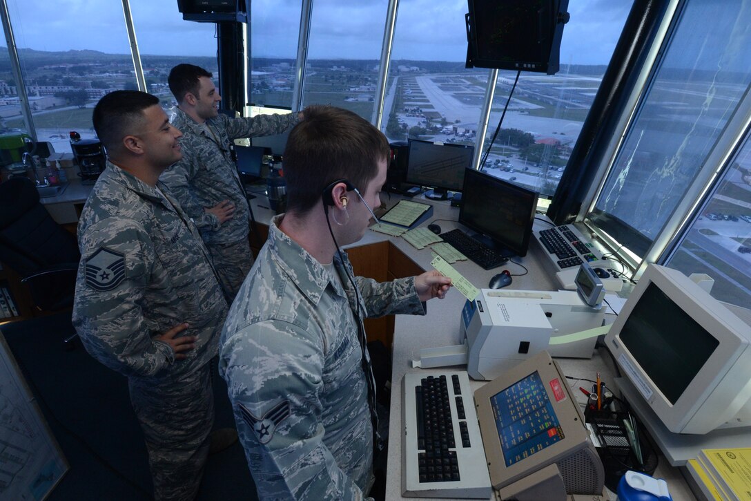 Senior Airman Michael-Paul Kendall, 36th Operations Support Squadron air traffic controller, clears an aircraft to take off from the Andersen Air Force Base, Guam, flightline Feb. 24, 2014, during Exercise Cope North 2014. The exercise, which is a joint effort between the U.S. Air Force, the Japan Air Self-Defense Force and the Royal Australian Air Force, is designed for allies to work together on both humanitarian assistance and disaster relief (HA/DR) missions as well as large force employment mission with dissimilar aircraft.
 (U.S. Air Force photo by Airman 1st Class Emily A. Bradley/Released)
