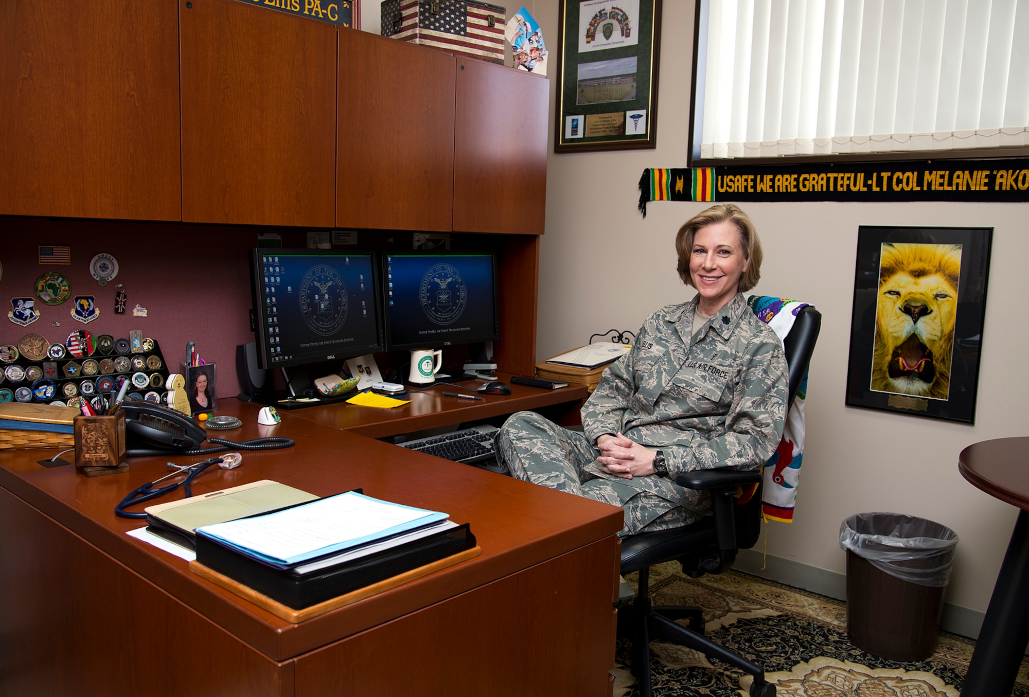 U.S. Air Force Lt. Col. Melanie Ellis, 35th Medical Operations Squadron commander, spends time at her desk at Misawa Air Base, Japan, Mar. 14, 2014. Ellis received the American Academy of Physician Assistant Federal PA of the Year award, surpassing both military and civilian counterparts in her field.  
(U.S. Air Force photo/Tech. Sgt. Araceli Alarcon)
