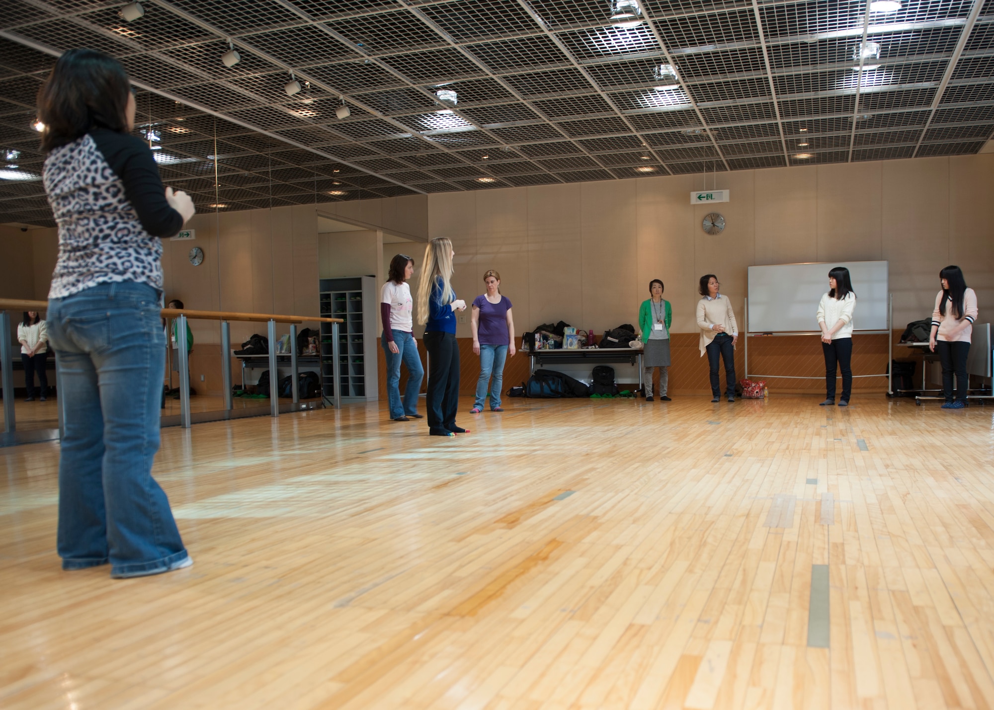 Center, Kristi McFadden, Mrs. Sakura 2013, speaks to students in a self-defense class at the Tachikawa Women’s Center AIM Mar. 10, 2014, in Tachikawa, Japan. The self-defense class taught hands-on techniques, but also taught participants to be aware of their surroundings. (U.S. Air Force photo by Senior Airman Desiree Economides/Released) 