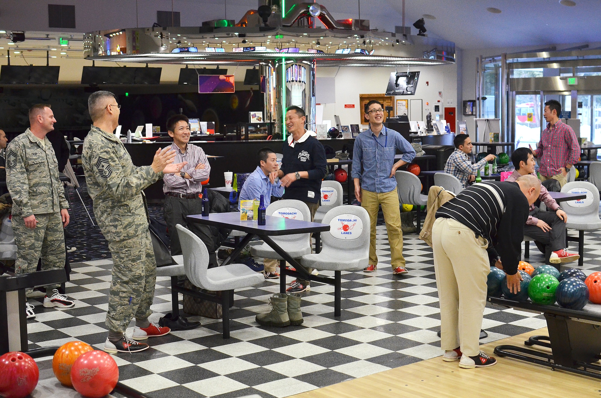 Yokota Air Base, Japan - Members of the 374th Airlift Squadron leadership along with local Japanese Air Self Defense Force senior enlisted leaders get together along with exchange students from both branches during a bowling event to conclude the Yokota portion of the Non-Commissioned Officer Exchange Program at Yokota Air Base, Japan, Feb. 24, 2014.  Eight NCO's from various JASDF bases came to Yokota and were sponsored by eight NCO's of the same careers from the 374th.  The host NCO's showed them how Yokota conducts its mission, as well as introduced them to some American culture.  The host NCO's then traveled to Komaki Air Base, Japan, where they were hosted by JASDF members to see how their counterparts conduct their mission.  (U.S. Air Force photo by Tech. Sgt. Christopher Marasky/Released)